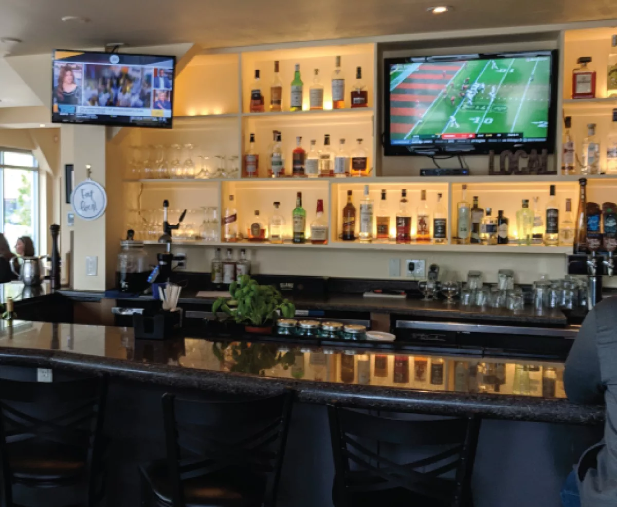TV Mounting, A/V system integration, and wire concealment in a local bar and restaurant for watching TV.